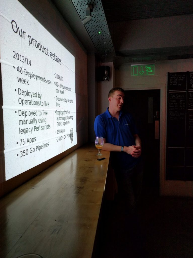 Simon Gunton leaning on the bar and answering questions from the attendees